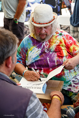 Wavy Gravy signing Woodstock book, Kate Wolf Music Festival, 2014