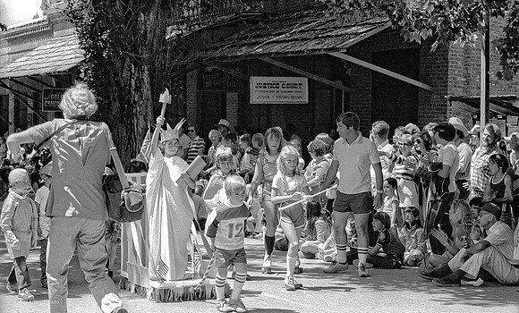 Charles Moore photographing 4th of July Parade